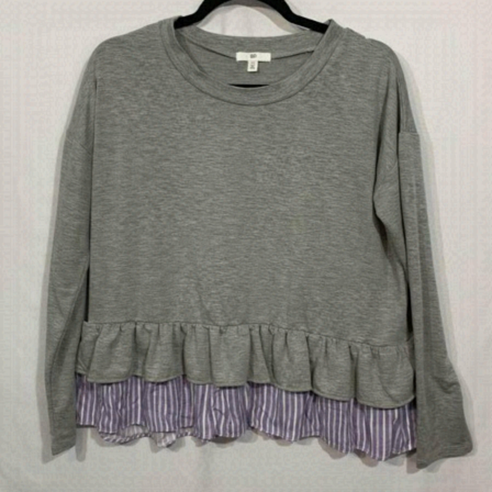 WOMAN’S lightweight peplum ruffle hem sweatshirt top. Size XS. Fits over…